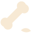 An illustration of a dog bone in the orange/brown color, with a small, indistinct shape beside it (possibly meant to be food or dirt).